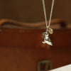 Puffin charm with gold cowrie neckchain