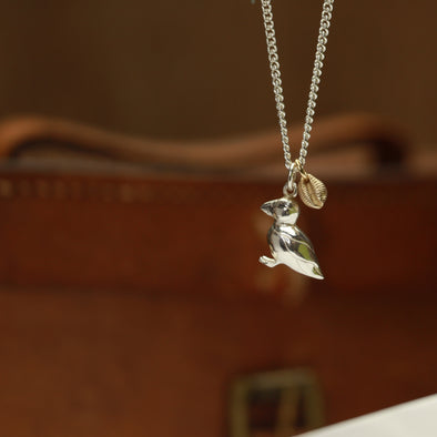 Puffin charm with gold cowrie neckchain